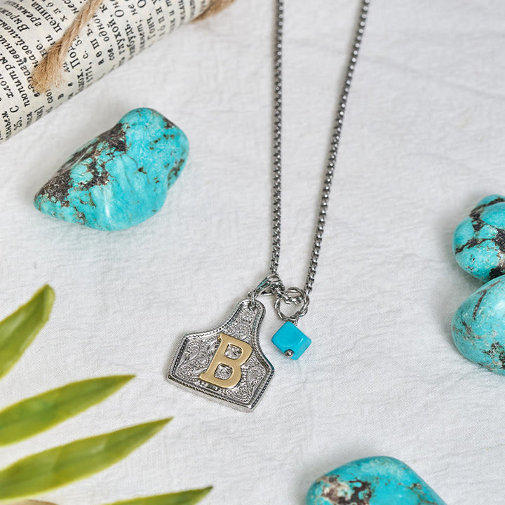 Collana con ciondolo turchese a forma di lettera bicolore in stile occidentale - image 2