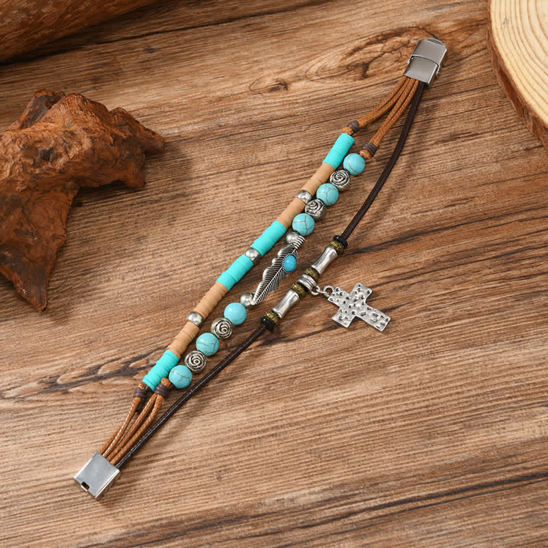 Bracciale in pelle a strati con piume turchesi e croce - image 2