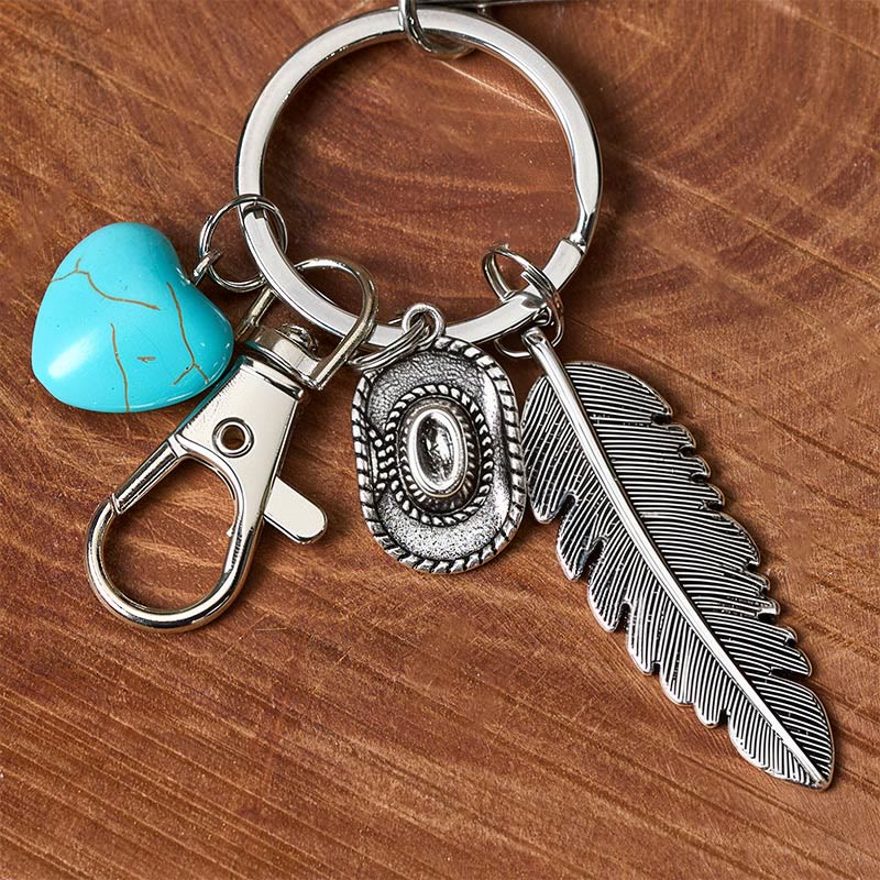 Portachiavi con coltello pieghevole in argento e ciondolo a forma di piuma western turchese. - image 3