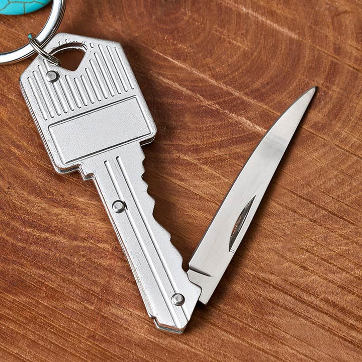 Portachiavi con coltello pieghevole in argento e ciondolo a forma di piuma western turchese. - image 2