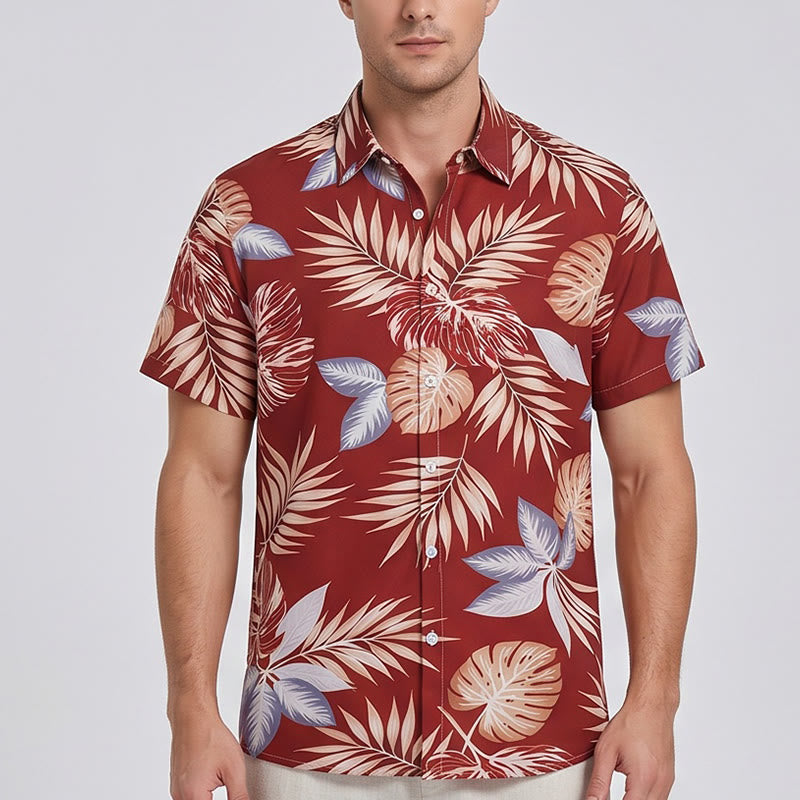 Camicia da uomo a maniche corte con stampa di foglie tropicali rosso acceso, ideale per le vacanze. - image 1