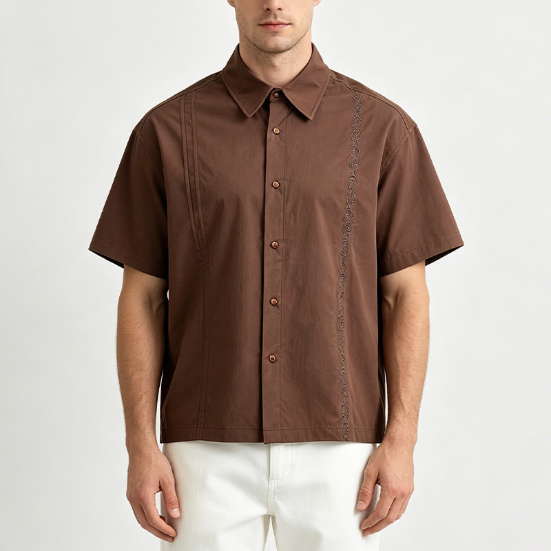 Camicia oversize a maniche corte marrone scuro con ricami laterali. - image 1