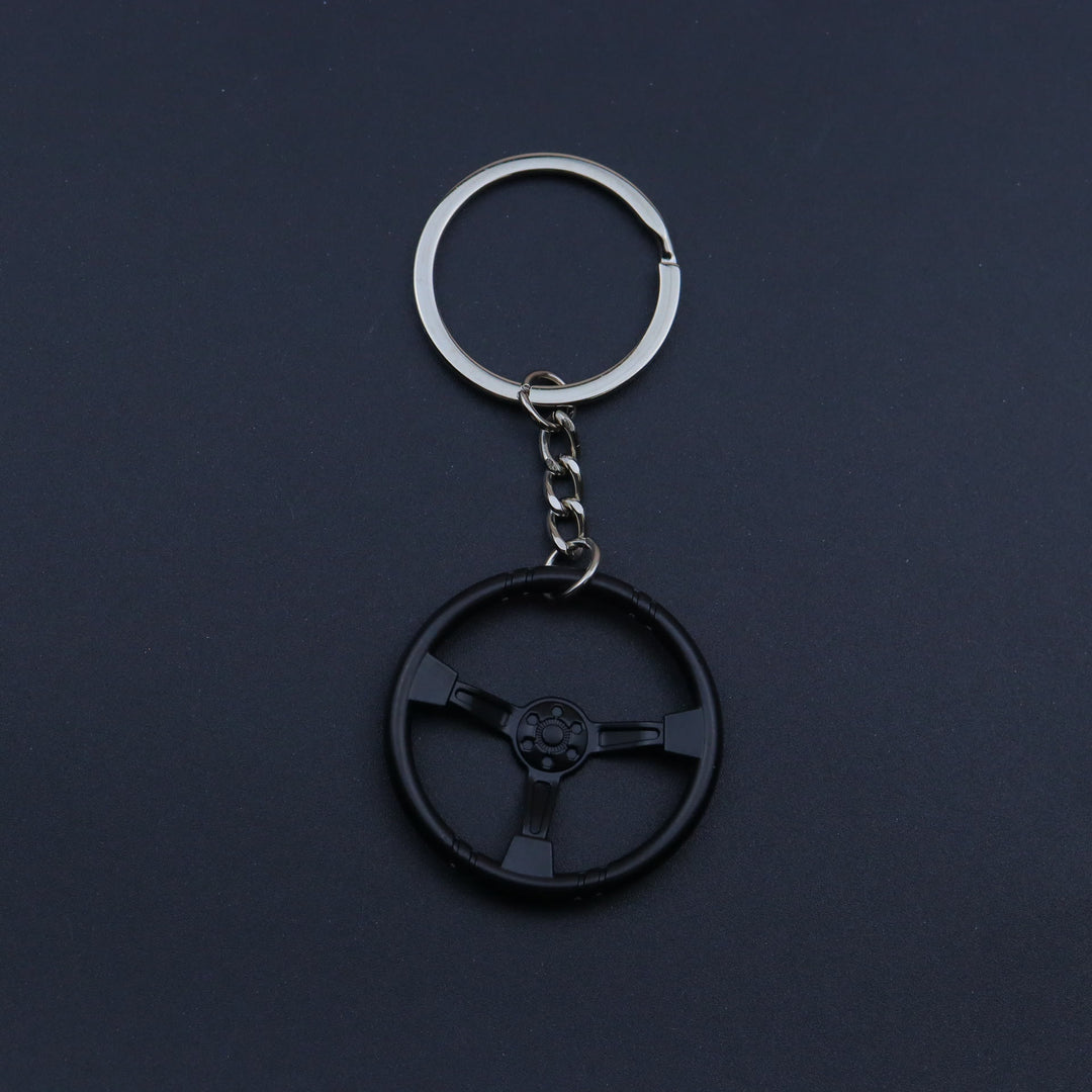 Collezione di portachiavi con design di mini auto moderne - Volante nero - image 19