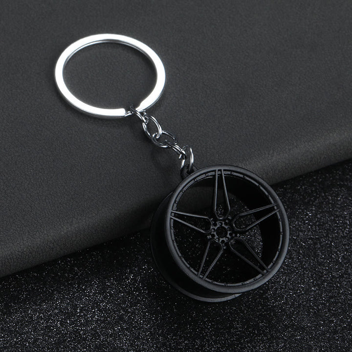 Collezione di portachiavi con design di mini auto moderne - Grande Ruota Nera - image 10