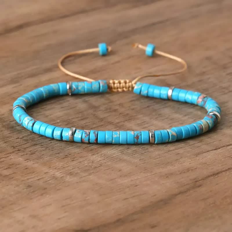 Bracciale regolabile con cordino e perline turchesi a disco. - Blu - image 1