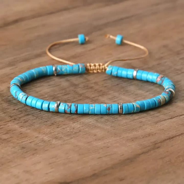 Bracciale regolabile con cordino e perline turchesi a disco. - Blu - image 1
