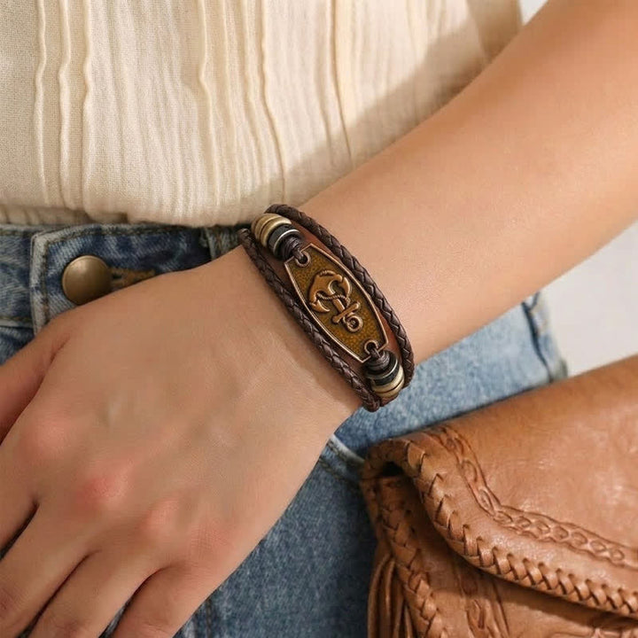 Bracciale vintage in bronzo antico con intreccio multistrato in pelle. - image 1