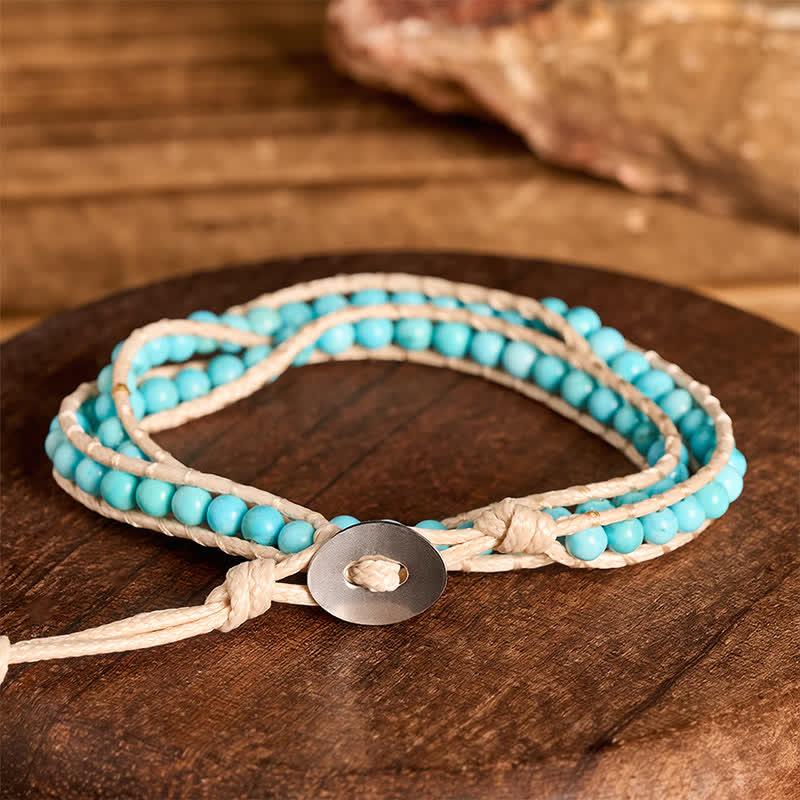 Bracciale a doppio giro pulito con perline turchesi e cordino beige - image 2