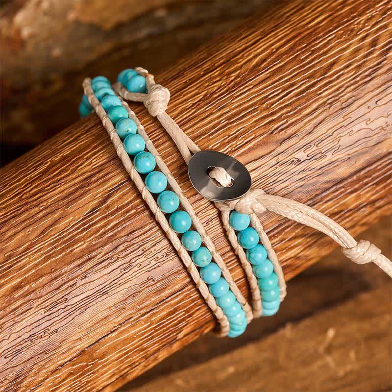 Bracciale a doppio giro pulito con perline turchesi e cordino beige - image 1