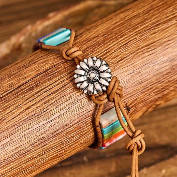 Bracciale in pelle con bottone di girasole e tubo turchese, ideale per trattamenti curativi. - image 1