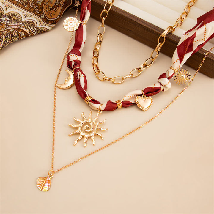 Set di 3 pezzi composto da bandana, sciarpa e collana con motivo a rombi bordeaux "Sole e Luna". - image 1