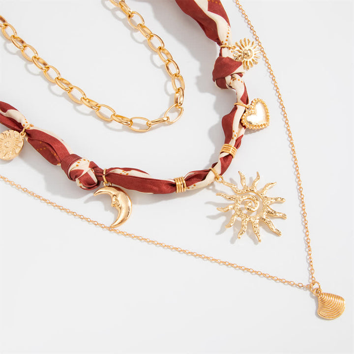 Set di 3 pezzi composto da bandana, sciarpa e collana con motivo a rombi bordeaux "Sole e Luna". - image 2