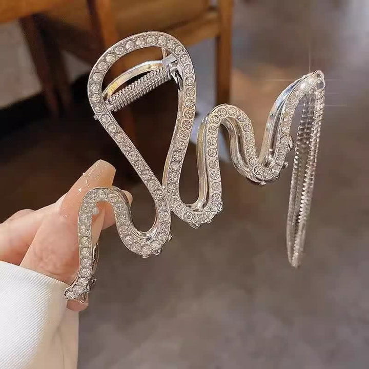 Fermaglio a clip da donna con strass e nappe di cristallo a forma di serpente. - image 2