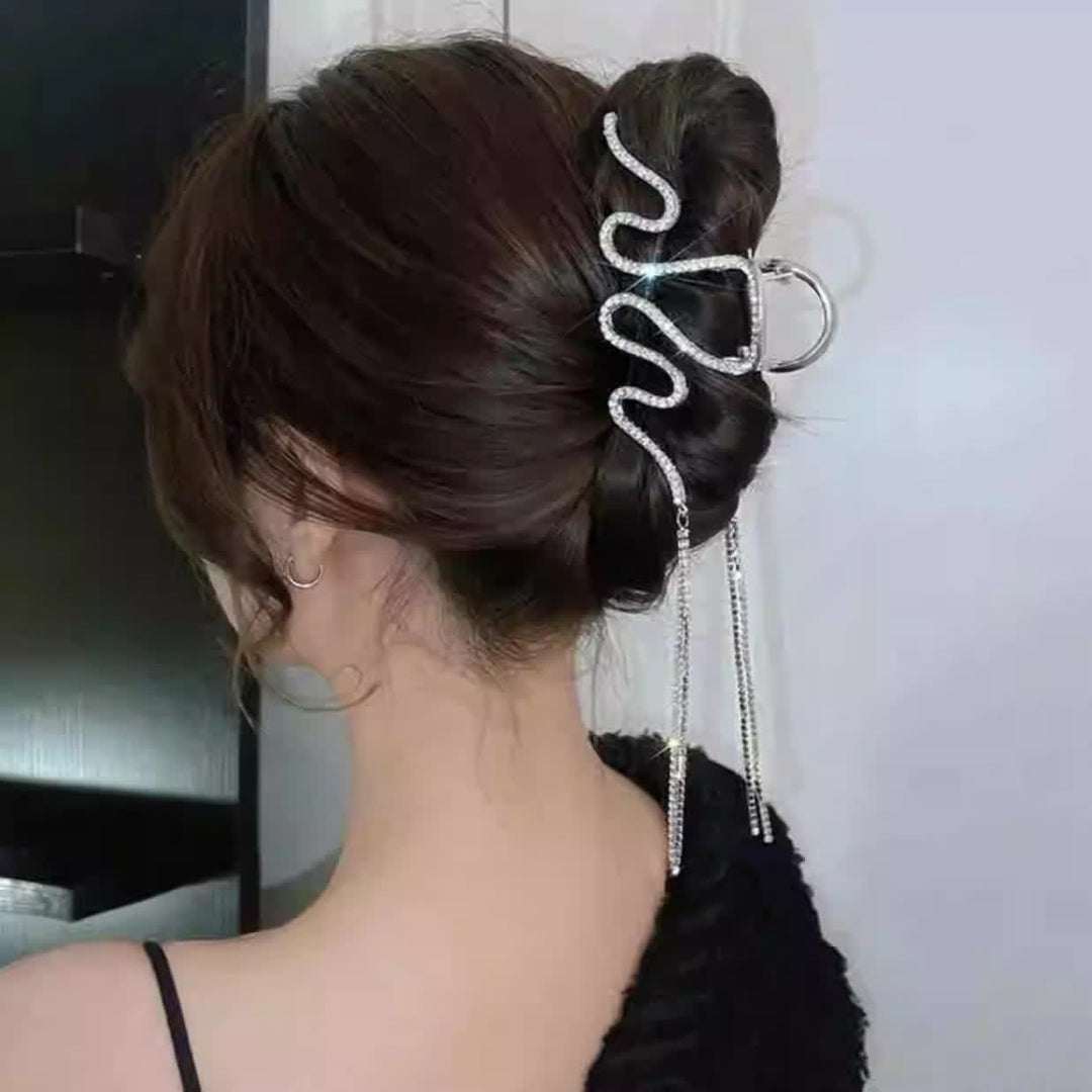 Fermaglio a clip da donna con strass e nappe di cristallo a forma di serpente. - image 1