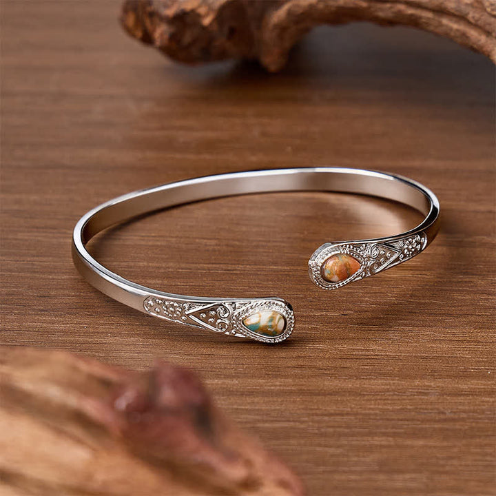 Bracciale aperto Rugged Beauty con due gocce di turchese. - image 11