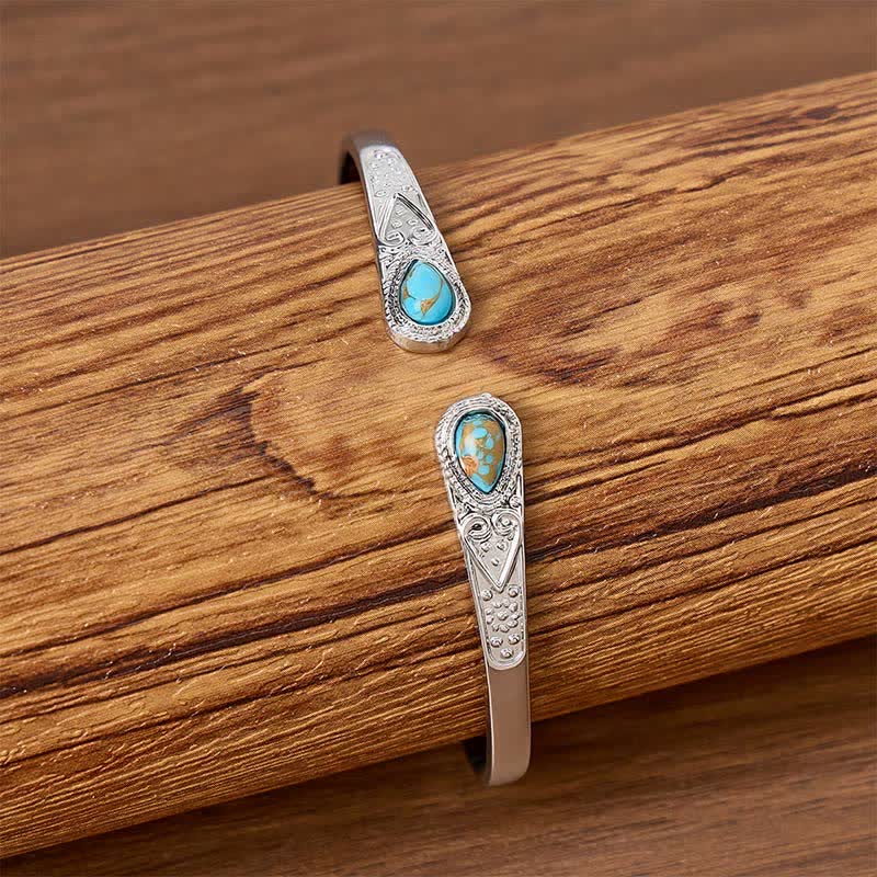 Bracciale aperto Rugged Beauty con due gocce di turchese. - image 1