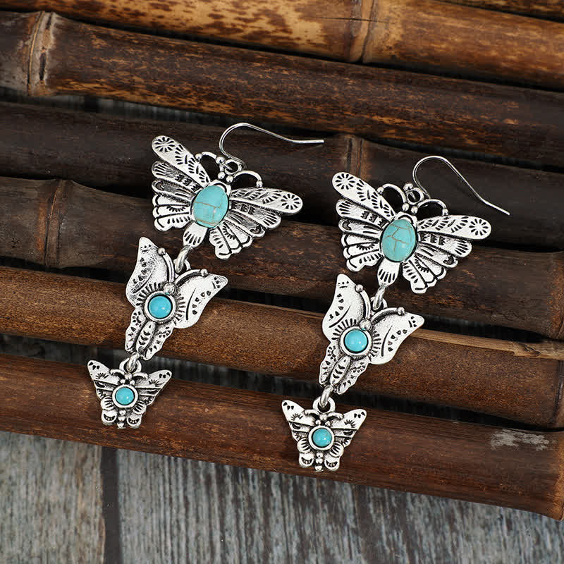 Orecchini pendenti stile boho con tripla farfalla turchese. - image 1