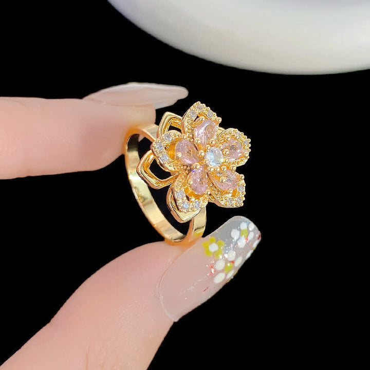 Anello antistress girevole con zirconi a forma di fiore di ciliegio - image 0