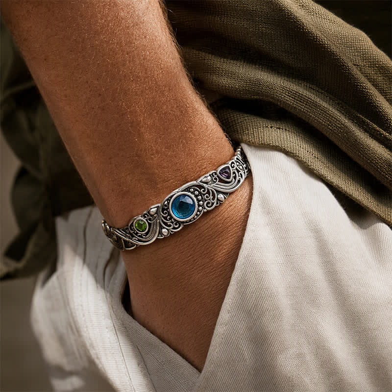 Bracciale a polsino aperto con pietre preziose decorate. - image 1
