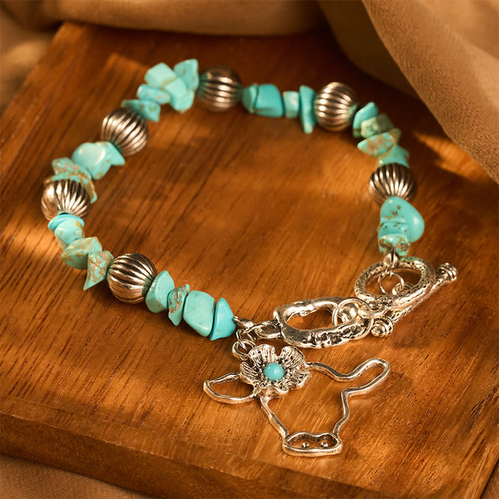 Bracciale vintage western con schegge di turchese, teschio di toro e fiori in argento antico e perline. - image 0