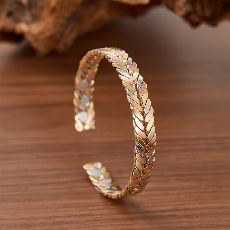 Bracciale rigido magnetico con apertura a polsino e treccia in rame tricolore. - Tricolore - image 0