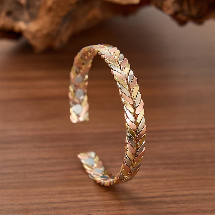 Bracciale rigido magnetico con apertura a polsino e treccia in rame tricolore. - Tricolore - image 0