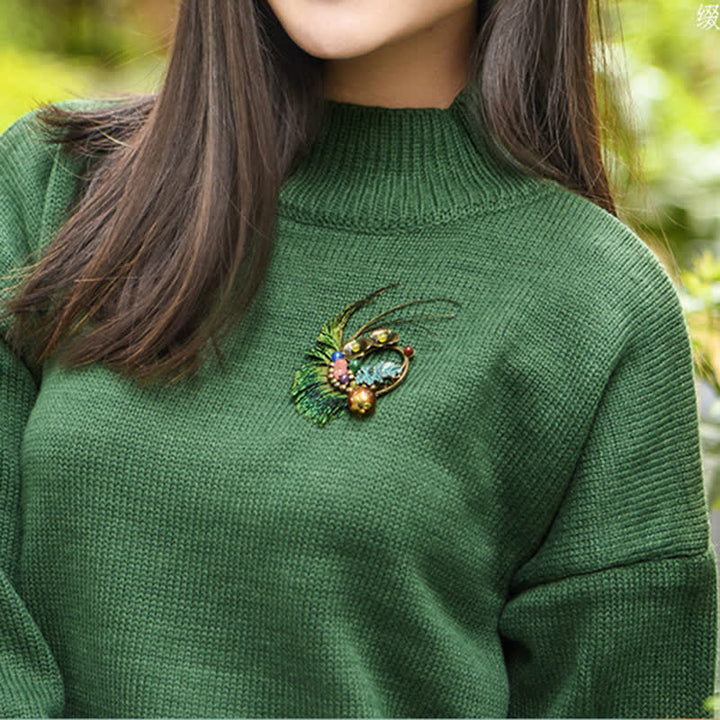 Spilla da donna retrò in bronzo con fiore e piuma di pavone