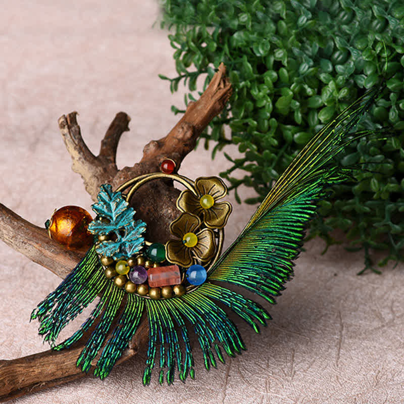 Spilla da donna retrò in bronzo con fiore e piuma di pavone