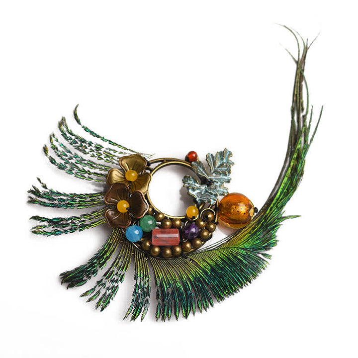 Spilla da donna retrò in bronzo con fiore e piuma di pavone