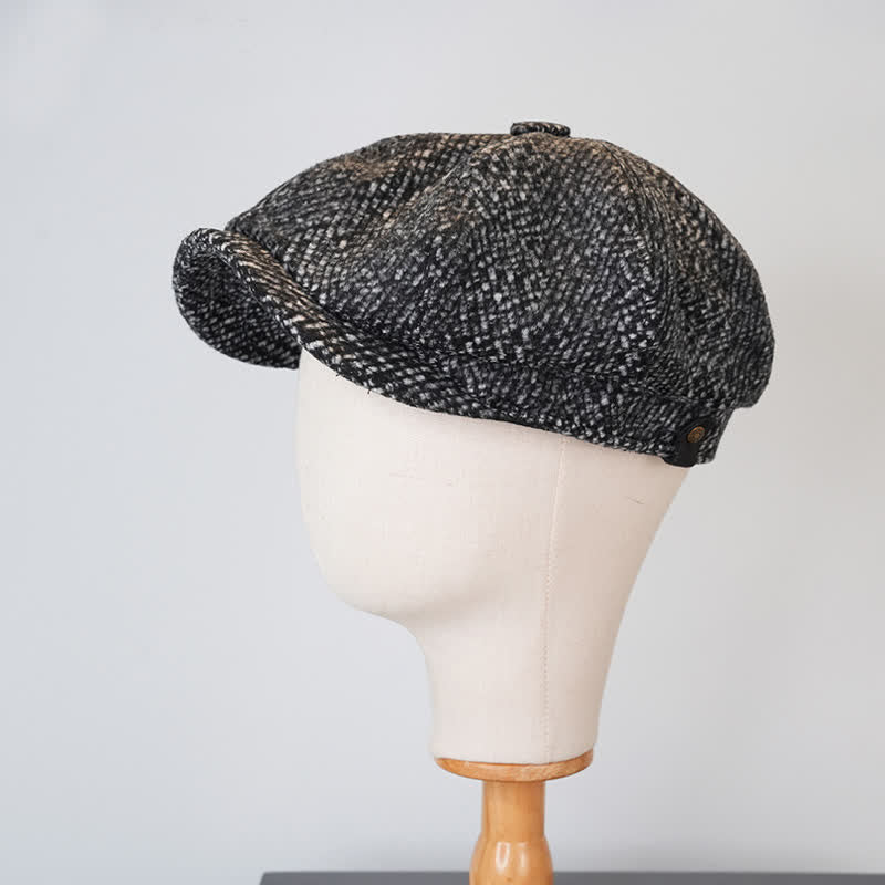 Berretto ottagonale da strillone in tweed maculato nero