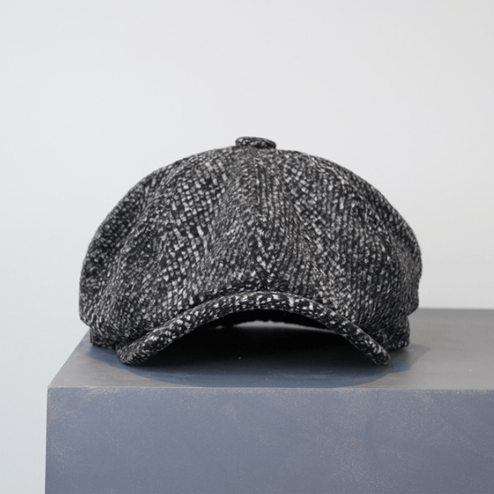 Berretto ottagonale da strillone in tweed maculato nero