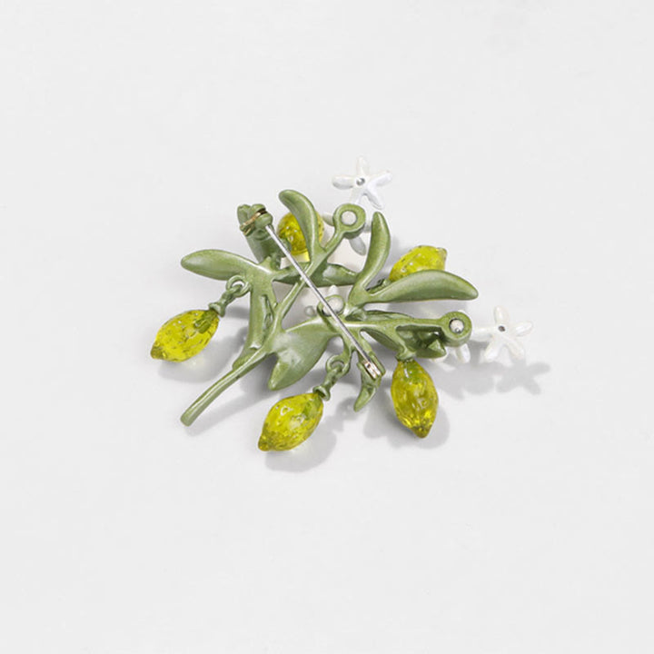 Spilla da donna a forma di goccia di limone con pianta verde