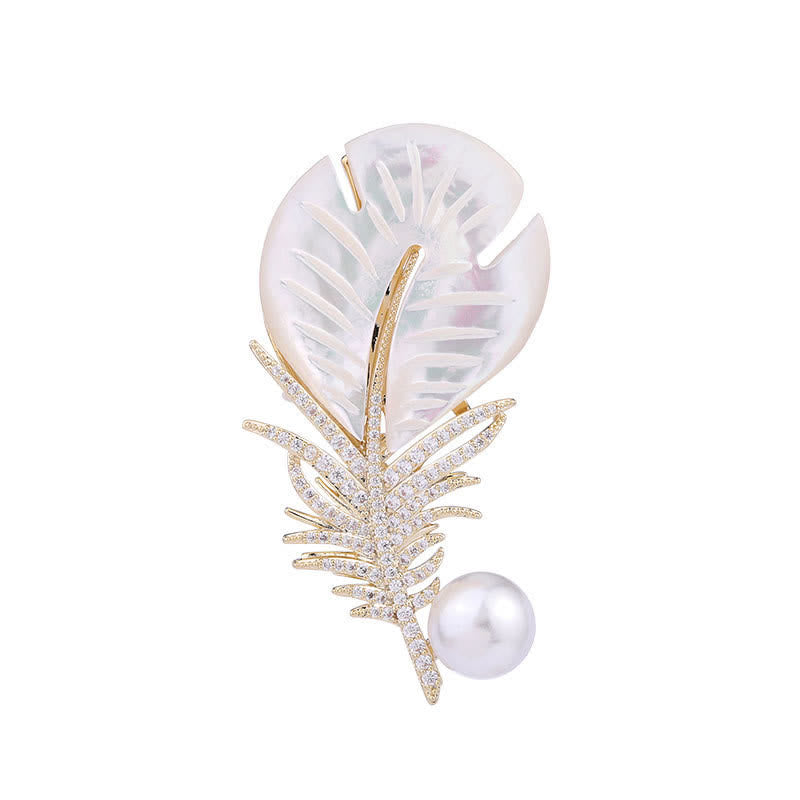 Spilla con piuma e conchiglia di perle da donna