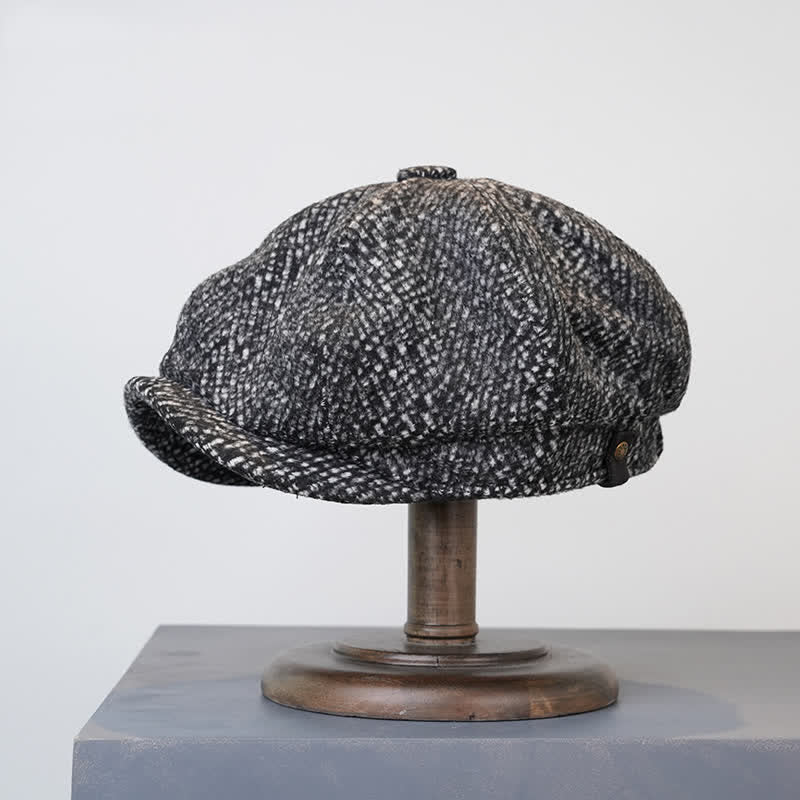 Berretto ottagonale da strillone in tweed maculato nero