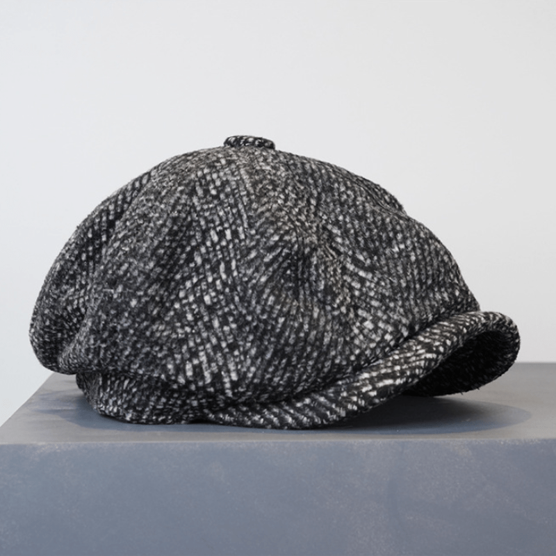 Berretto ottagonale da strillone in tweed maculato nero