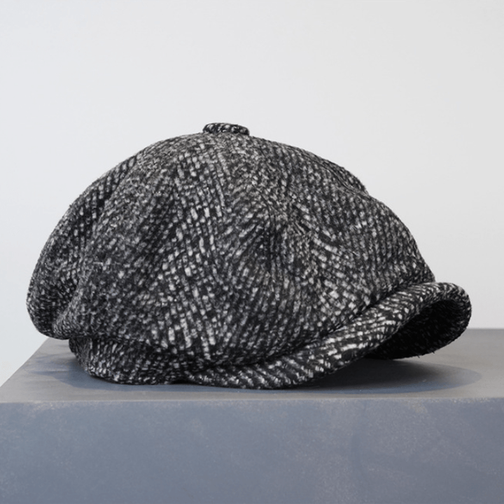 Berretto ottagonale da strillone in tweed maculato nero