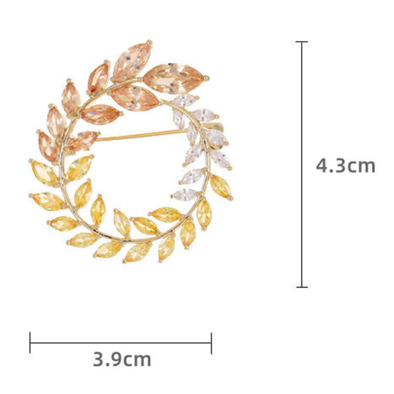 Spilla da donna con foglie di grano dorate e zirconi