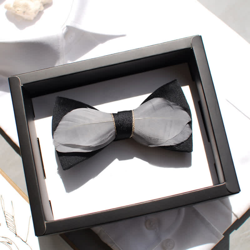 Papillon in velluto grigio e nero con piume